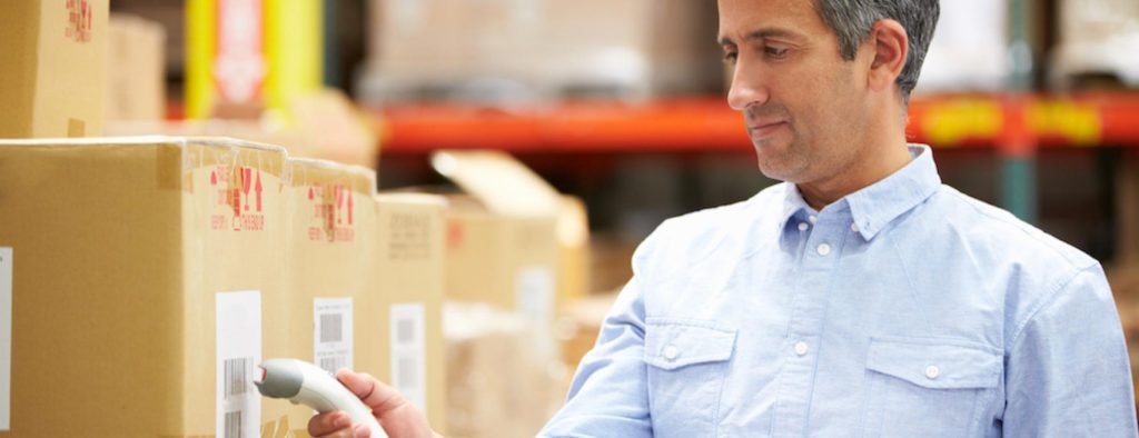 worker scanning barcode on boxes