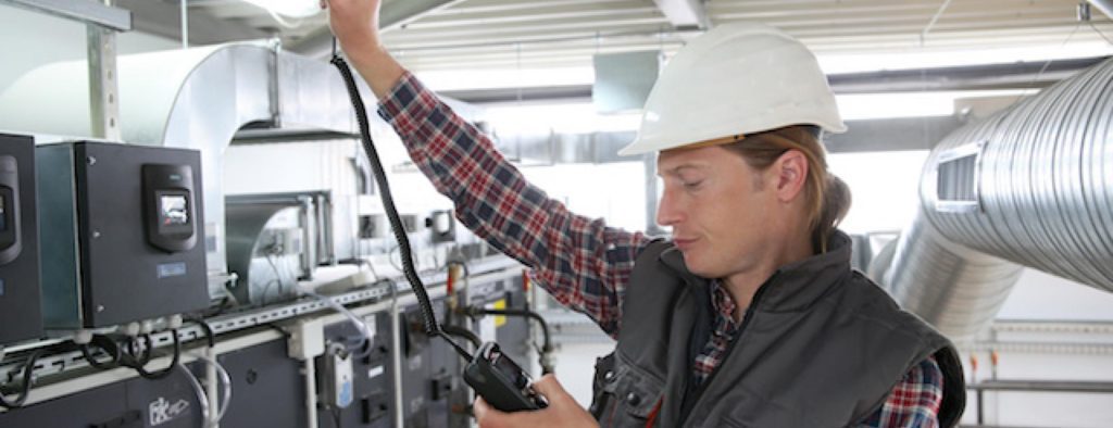 Worker checking air quality inside workplace