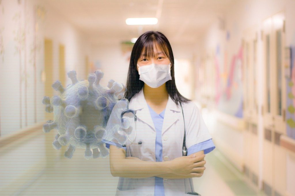 woman in hospital with facemask on to help prevent the spread of diseases