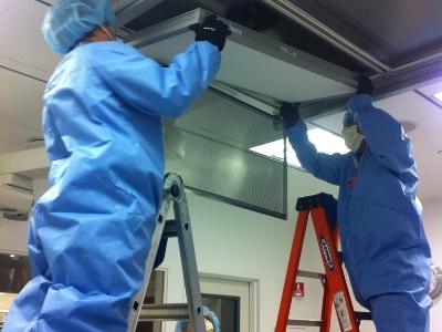 Filter Techs installing filters in a hospital